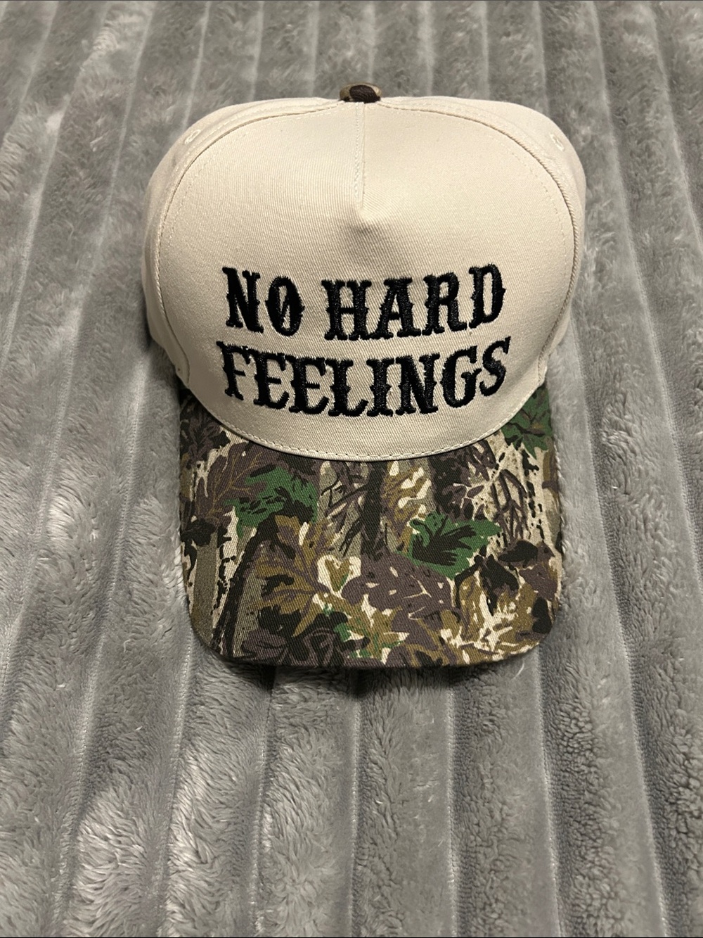 'No Hard Feelings' Trucker Hat with Camo Brim